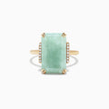 The 14K Yellow Gold Jade and Diamond Ring, 11.56 TCW, showcases a large rectangular jade center accented by sparkling round diamonds on each side, set against a white background.