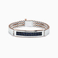 The Mens Sterling Silver and Rose Gold Black Sapphire Bracelet, 4.20 TCW, features a rectangular centerpiece with rows of black sapphires on silver and rose gold links, displayed against a white background.