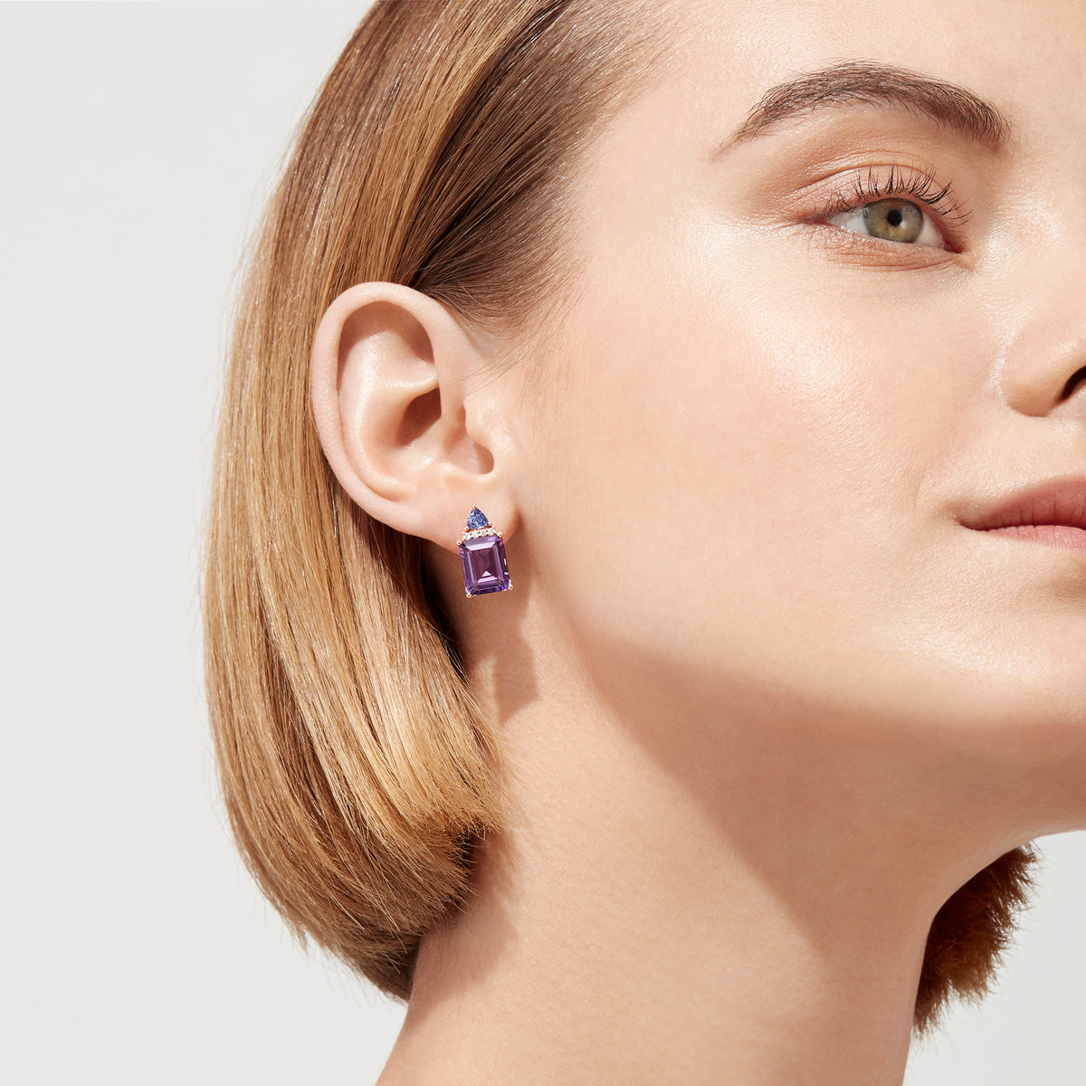 14K Rose Gold Earrings featuring large amethyst gemstones topped with a triangular cluster of tanzanite and diamonds, 8.62 TCW, displayed on a white background.