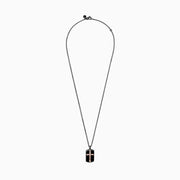 The Mens Rhodium Sterling Silver and Rose Gold Plated Cross Pendant features a black dog tag with a raised rose gold cross at the center, on a black chain, displayed against a white background.