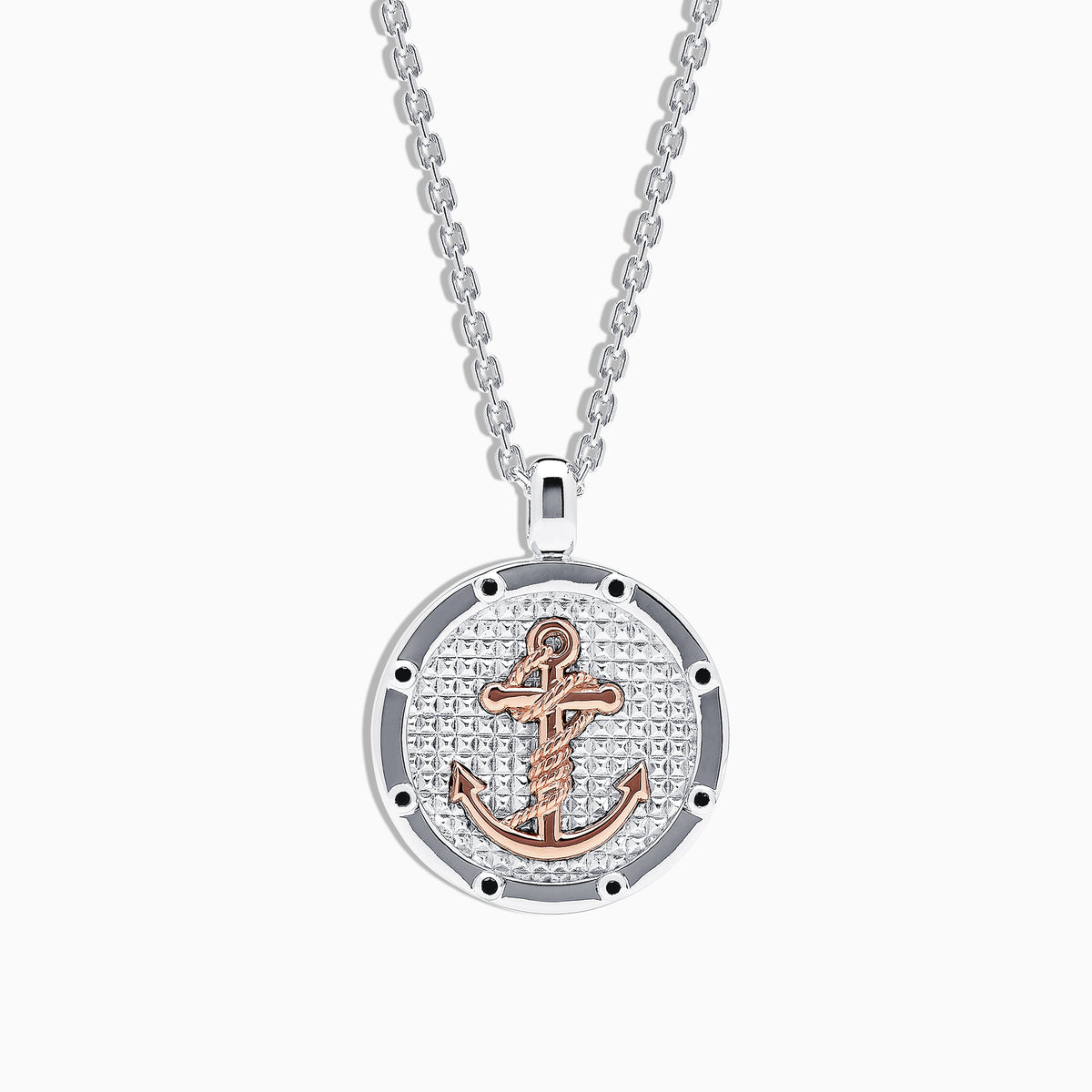 The Mens Sterling Silver and 18K Rose Gold Plated Anchor Pendant features a round, textured silver design with a rose gold anchor at the center, hanging from a sleek silver chain—part of our mens jewelry collection.
