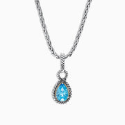 A 925 sterling silver and 18K yellow gold necklace showcasing a blue topaz pendant (3.14 TCW), elegantly framed in a twisted rope design.