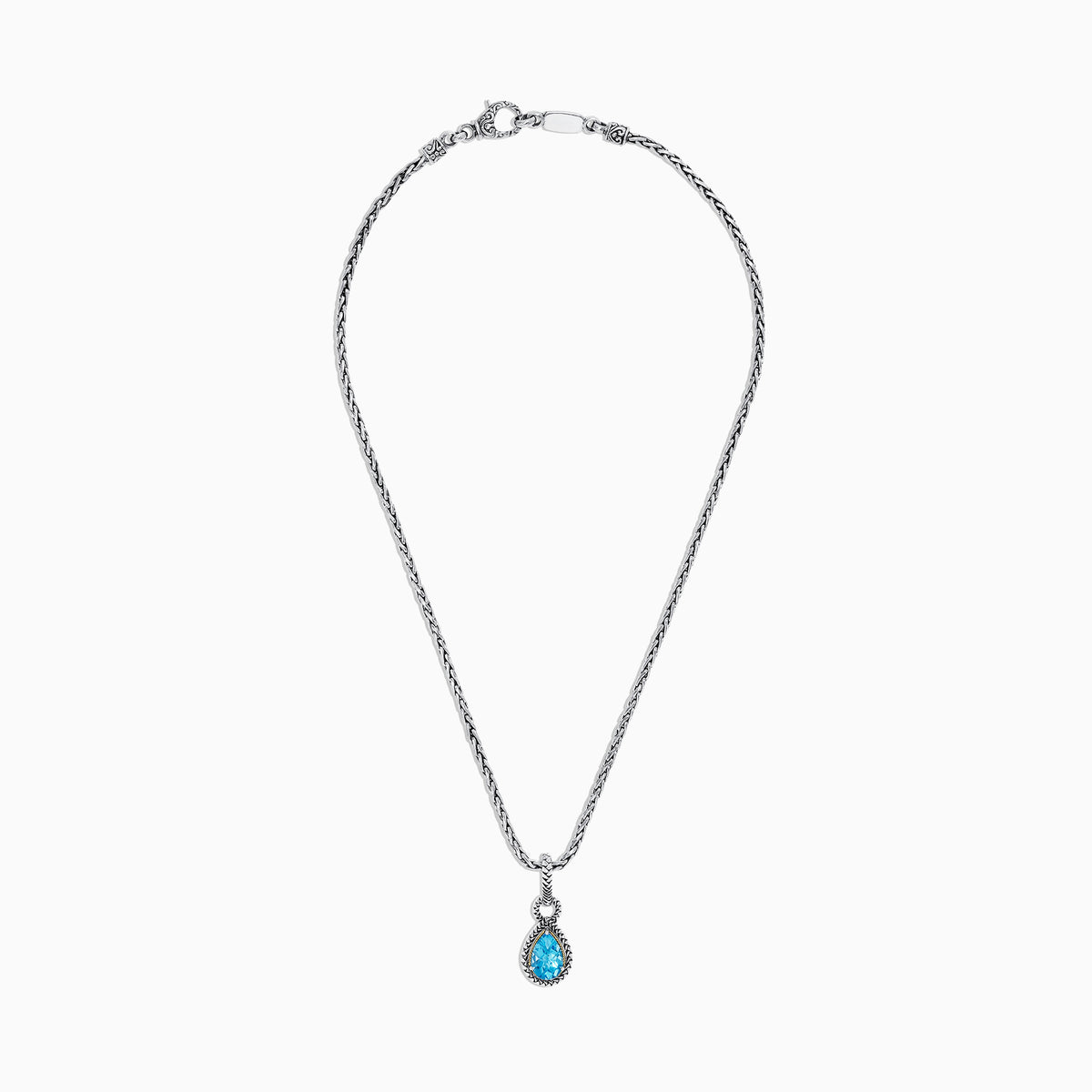 A 925 sterling silver and 18K yellow gold necklace showcasing a blue topaz pendant (3.14 TCW), elegantly framed in a twisted rope design.