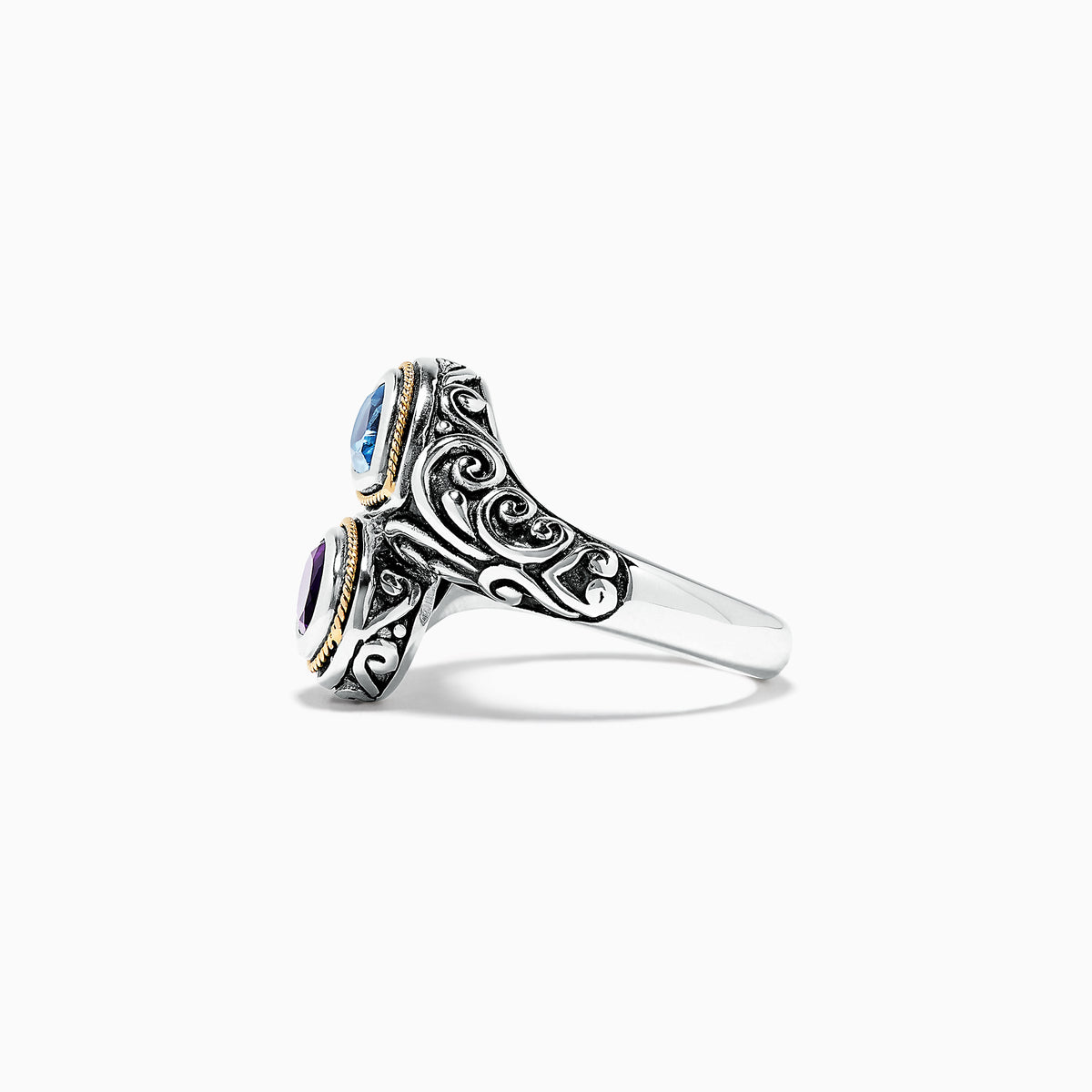The 925 Sterling Silver & 18K Gold Topaz and Amethyst Ring, 1.62 TCW, features ornate patterns and two teardrop gemstones—blue topaz and purple amethyst—set side by side in gold-edged bezels on a white background.