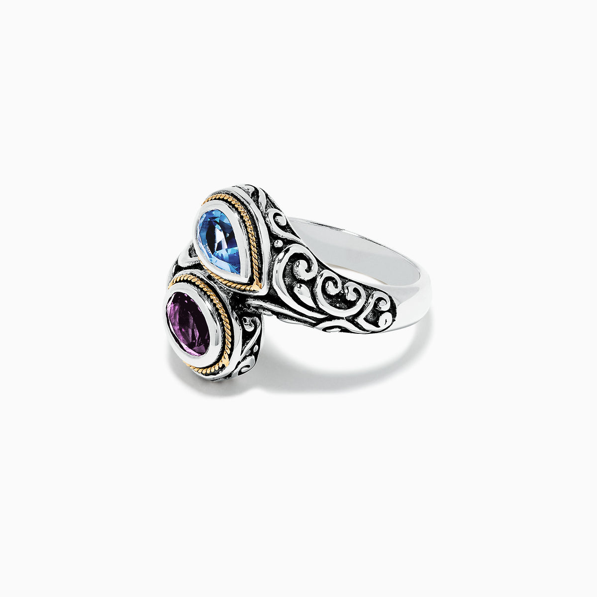 The 925 Sterling Silver & 18K Gold Topaz and Amethyst Ring, 1.62 TCW, features ornate patterns and two teardrop gemstones—blue topaz and purple amethyst—set side by side in gold-edged bezels on a white background.