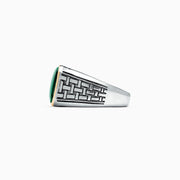The Mens Sterling Silver and 14K Yellow Gold Malachite Ring, 6.05 TCW, features an intricate geometric pattern and a rectangular green malachite stone set in a yellow gold bezel, shown on a plain white background.