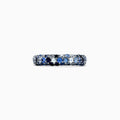 The 925 Sterling Silver Blue Sapphire Splash Ring, 1.80 TCW, features a band set with alternating light and dark blue gemstones, including blue sapphire, elegantly displayed on a plain white background.