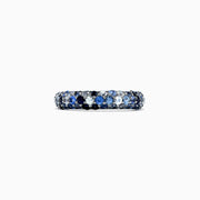 The 925 Sterling Silver Blue Sapphire Splash Ring, 1.80 TCW, features a band set with alternating light and dark blue gemstones, including blue sapphire, elegantly displayed on a plain white background.
