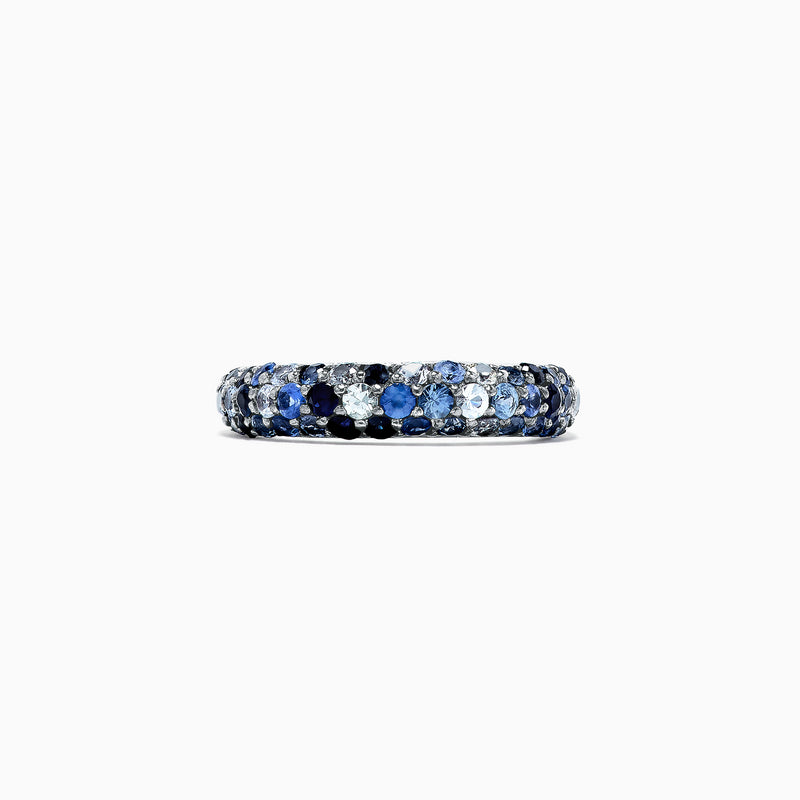 The 925 Sterling Silver Blue Sapphire Splash Ring, 1.80 TCW, features a band set with alternating light and dark blue gemstones, including blue sapphire, elegantly displayed on a plain white background.