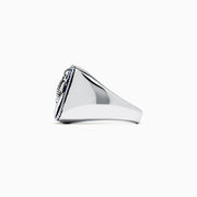 The Mens Sterling Silver Lapis Lazuli Anchor Ring, 5.90 TCW, features a raised anchor on a rectangular deep blue lapis lazuli stone with a rope-style border.