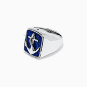 The Mens Sterling Silver Lapis Lazuli Anchor Ring, 5.90 TCW, features a raised anchor on a rectangular deep blue lapis lazuli stone with a rope-style border.