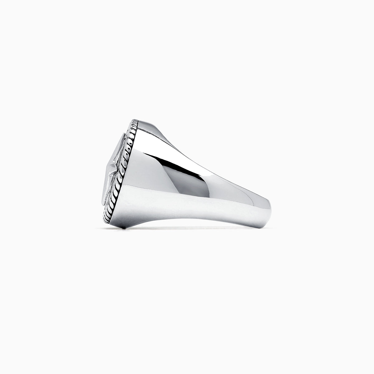 The Mens Sterling Silver Compass Ring showcases a detailed star at the center and engraved directional markers (N, E, S, W) around the edge. Its striking design is highlighted against a plain white background.