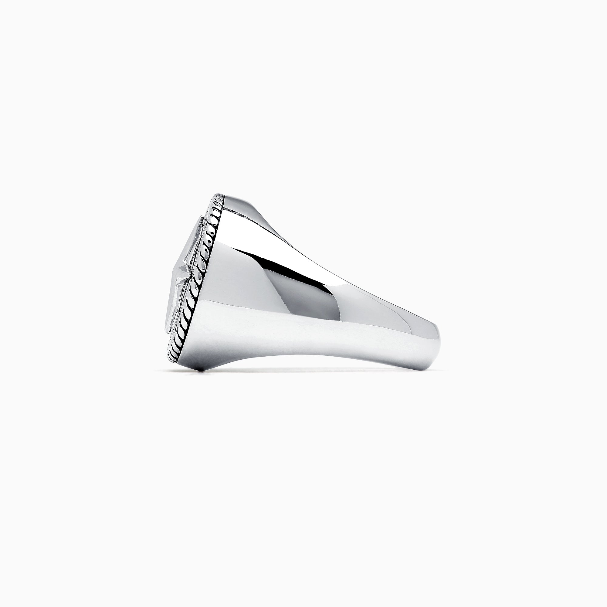 The Mens Sterling Silver Compass Ring showcases a detailed star at the center and engraved directional markers (N, E, S, W) around the edge. Its striking design is highlighted against a plain white background.