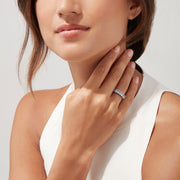 The Aquarius Sterling Silver Aquamarine Ring, 1.50 TCW, features a row of seven elongated oval light blue gemstones and is showcased on a plain white background.