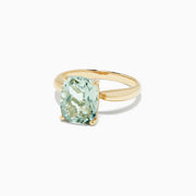 The 14K Yellow Gold Green Amethyst Ring features a 3.95 TCW rectangular cushion-cut gemstone set in a simple four-prong setting, shown against a white background.