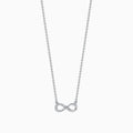 The Novelty 14K White Gold Diamond Infinity Necklace features a delicate infinity symbol pendant with 0.09 TCW diamonds, centered on a fine chain against a white background.