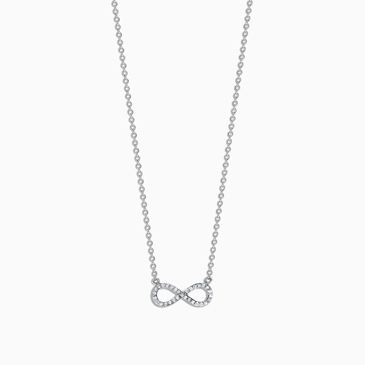 The Novelty 14K White Gold Diamond Infinity Necklace features a delicate infinity symbol pendant with 0.09 TCW diamonds, centered on a fine chain against a white background.