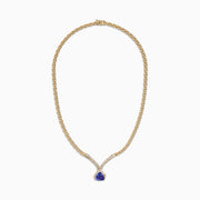 The Nahla Siri 14K Yellow Gold Tanzanite and Diamond Necklace (3.66 TCW) features a teardrop tanzanite pendant encircled by diamonds, with additional diamonds set along the chain for an elegant touch.