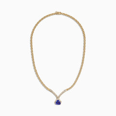 The Nahla Siri 14K Yellow Gold Tanzanite and Diamond Necklace (3.66 TCW) features a teardrop tanzanite pendant encircled by diamonds, with additional diamonds set along the chain for an elegant touch.