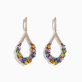 Watercolors 14K Yellow Gold Sapphire and Diamond Earrings, 7.56 CW, feature teardrop shapes with multicolored sapphires and small diamonds on the curves and hooks, shown against a white background.