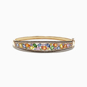 The Watercolors 14K Yellow Gold Multi Sapphire & Diamond Bangle, 6.02 TCW, features a row of multicolored sapphires in various shapes, edged with sparkling round diamonds for a vibrant and elegant look.