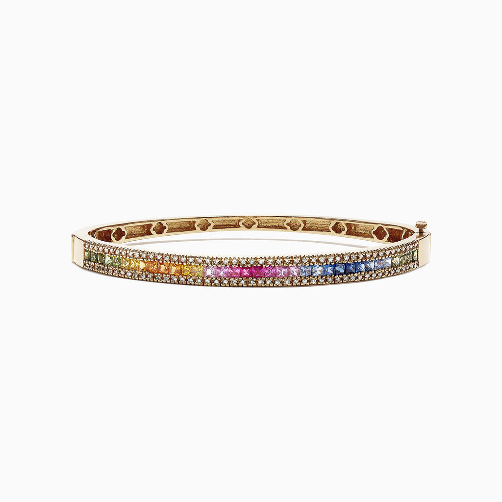 The Watercolors 14K Yellow Gold Multi Sapphire & Diamond Bangle (3.60 TCW) features a vivid gradient of green, yellow, orange, pink, and blue sapphires set in gold, shown against a white background.