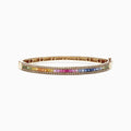 The Watercolors 14K Yellow Gold Multi Sapphire & Diamond Bangle (3.60 TCW) features a vivid gradient of green, yellow, orange, pink, and blue sapphires set in gold, shown against a white background.