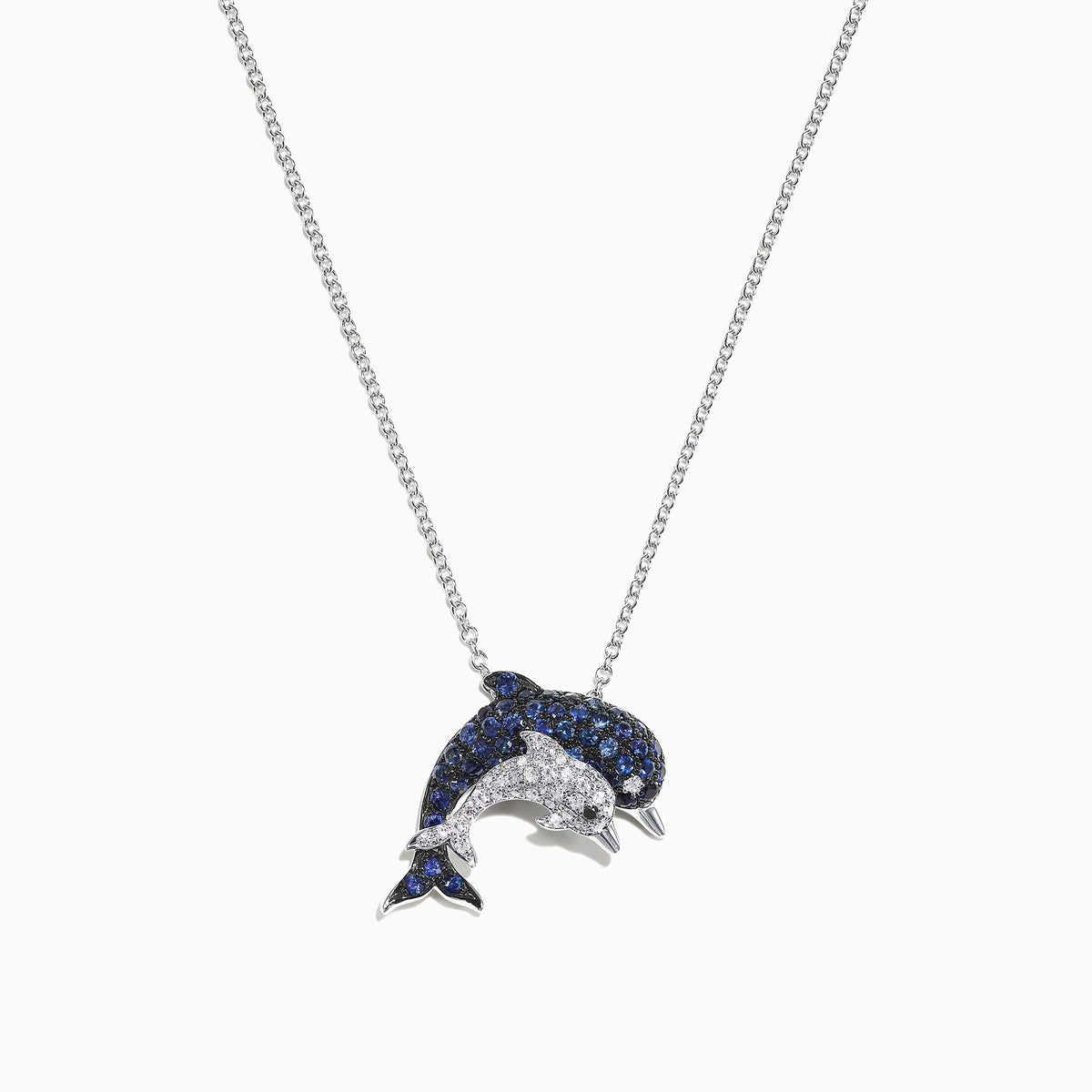The Seaside 14K White Gold Sapphire & Diamond Dolphins Pendant (0.71 TCW) features sapphire-blue and diamond-clear stones in a dolphin design, displayed on a white background.