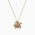 The Watercolors 14K Gold Sapphire & Diamond Turtle Pendant (0.99 TCW) features a gold turtle with a colorful gemstone shell and sparkling sapphire, suspended from a delicate gold chain, shown against a white background.