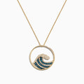 The Seaside 14K Yellow Gold Blue & White Diamond Wave Pendant (0.53 TCW) features a circular charm with a wave design, set with blue and white diamonds, and is displayed against a plain white background.