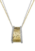 The DOro Two Tone 14K Yellow and White Gold Diamond Pendant, 0.20 TCW, features diamond accents and hangs from an elegant two-tone gold and silver chain.