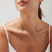 The Watercolors 14K Yellow Gold Multi Sapphire Cross Pendant, 2.05 TCW, showcases vibrant square sapphires in pink, blue, green, orange, and yellow on a stunning yellow gold chain necklace.