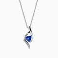 The Nahla Siri 14K White Gold Tanzanite & Diamond Pendant (1.46 TCW) features a twisted design with a triangular tanzanite gemstone and a row of sparkling diamonds set along one curve.