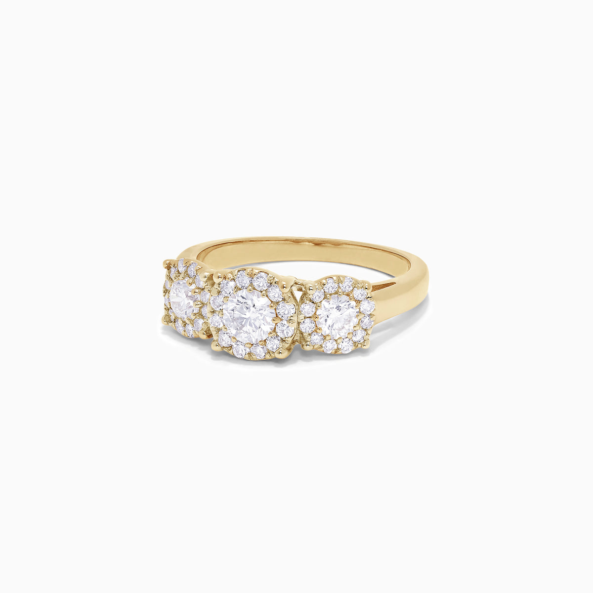 The Bouquet 14K Yellow Gold Three-Stone Diamond Halo Ring, 1.01 TCW, showcases three round diamonds with sparkling halos set in a thick gold band, displayed on a plain white background.