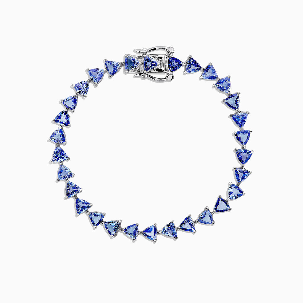 The Nahla Siri Sterling Silver Tanzanite Tennis Bracelet, 11.40 TCW, features a circle of evenly spaced triangular tanzanite gemstones and is finished with a secure clasp.