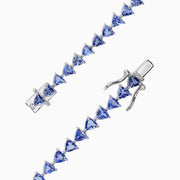 The Nahla Siri Sterling Silver Tanzanite Tennis Bracelet, 11.40 TCW, features a circle of evenly spaced triangular tanzanite gemstones and is finished with a secure clasp.