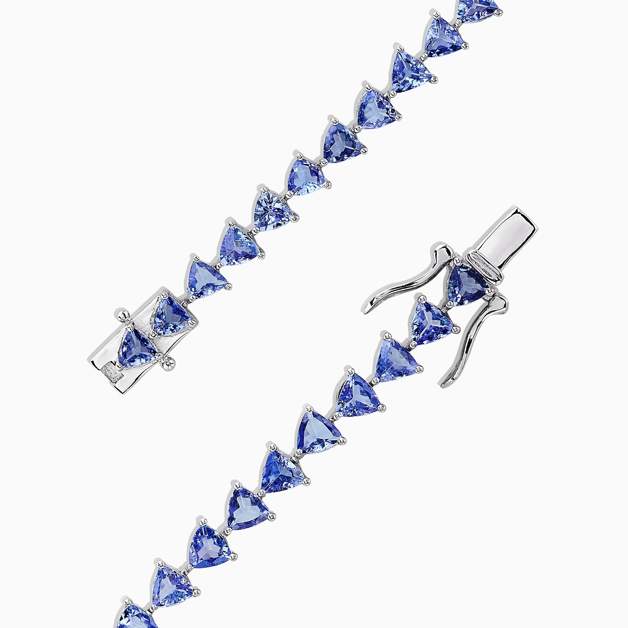 The Nahla Siri Sterling Silver Tanzanite Tennis Bracelet, 11.40 TCW, features a circle of evenly spaced triangular tanzanite gemstones and is finished with a secure clasp.