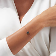 The Signature 14K Rose Gold Black Diamond & Emerald Bracelet, 0.44 TCW, features a delicate chain with a panther head charm set with black diamonds and emeralds, shown on a plain white background.