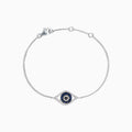 The Novelty 14K White Gold Sapphire & Diamond Evil Eye Bracelet, 0.43 TCW, features a central eye charm set with blue sapphires and diamonds on a fine chain with lobster clasp. Shown on a plain white background.