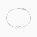 The Novelty 14K White Gold Diamond Infinity Bracelet, 0.12 TCW, features a sparkling infinity symbol on a delicate chain with clasp closure and three adjustable loops for an ideal fit.