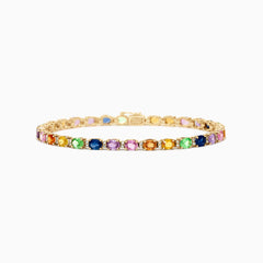 The Watercolors 14K Gold Multi Sapphire and Diamond Bracelet, 8.96 TCW, showcases a vibrant row of round blue, purple, pink, orange, yellow, and green sapphires sparkling on the gold band against a white background.