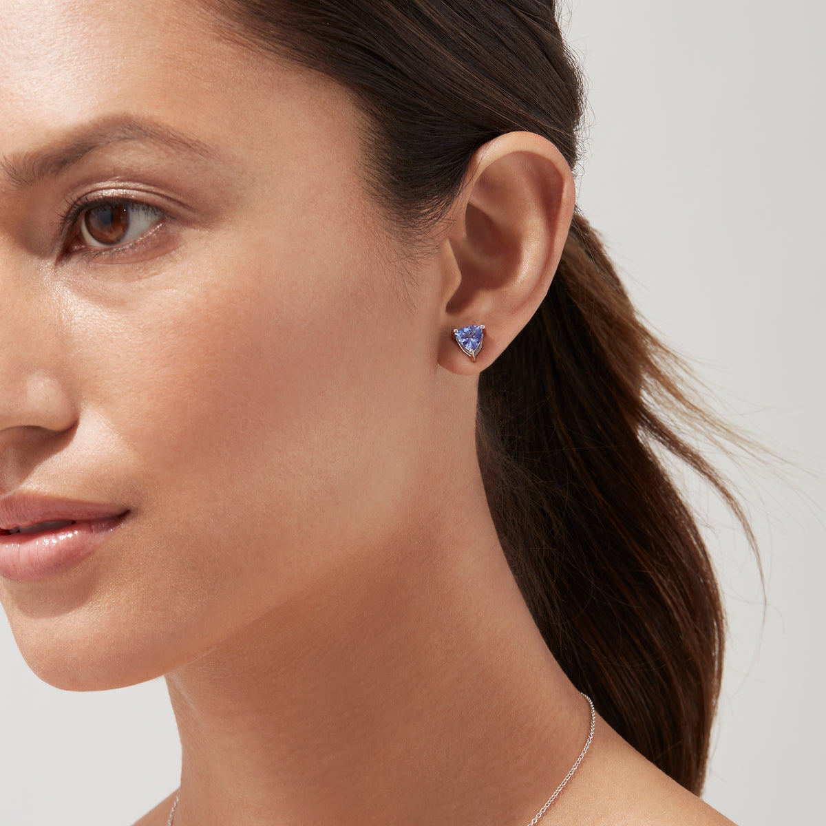Nahla Siri Sterling Silver Tanzanite Stud Earrings, 1.52 TCW, feature triangular-cut gemstones in three-prong mounts and are shown on a white background.