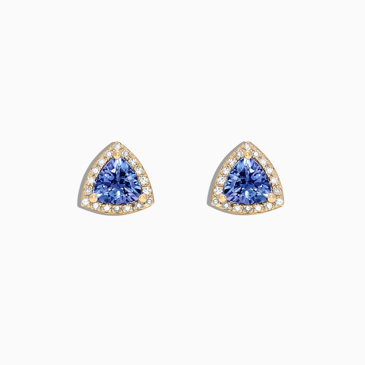 A pair of Nahla Siri 14K Yellow Gold Tanzanite and Diamond Stud Earrings, 1.19 TCW, featuring triangular blue stones surrounded by diamonds, is displayed on a white background.