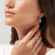 The Royale Bleu 14K Two Tone Gold Sapphire and Diamond Earrings, 0.93 TCW, feature sapphire teardrops encircled by diamonds, set in elegant two-tone gold and shown on a white background.