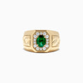 The Mens 14K Yellow Gold Emerald and Diamond Ring, 1.55 TCW, features an oval green emerald with a diamond halo, set on a wide band engraved with geometric patterns.