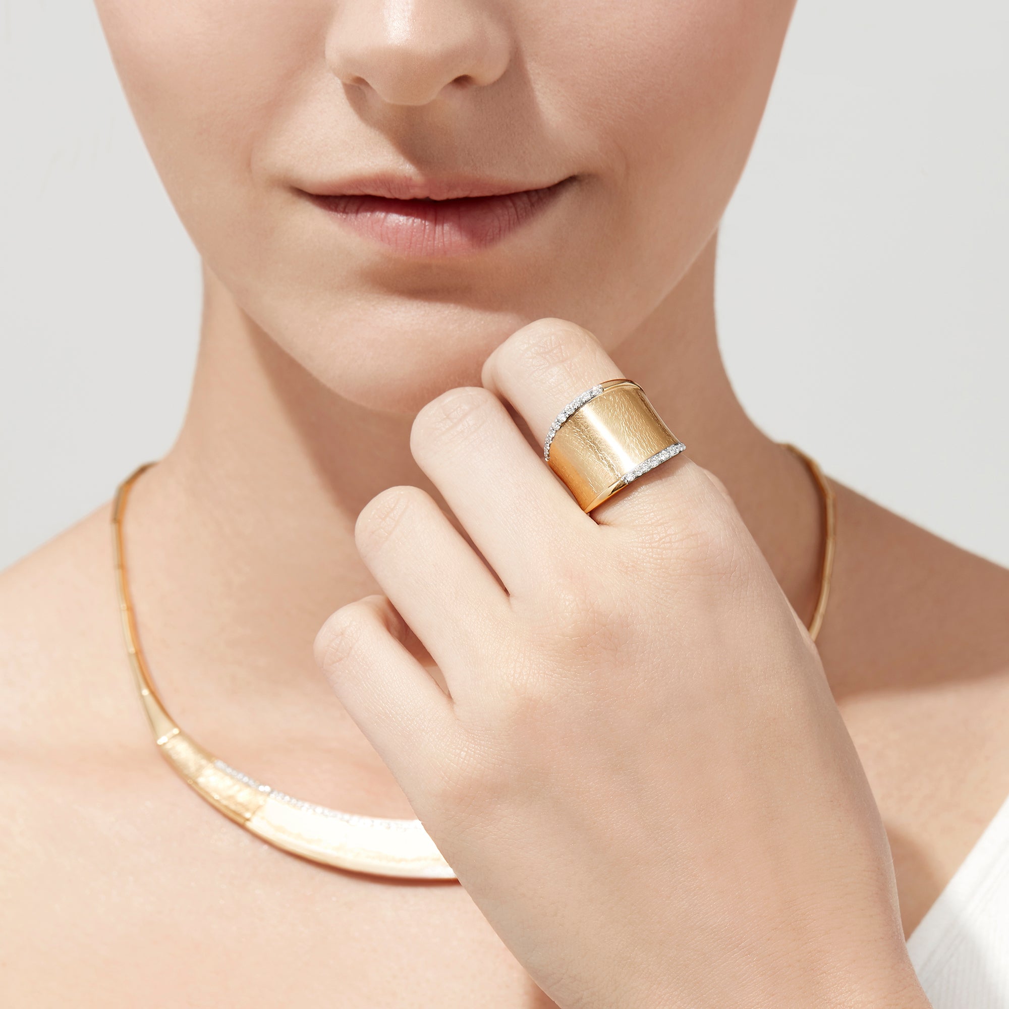 The DOro 14K Yellow Gold Diamond Accented Ring (0.27 TCW) features a wide band with a brushed finish and two rows of sparkling white diamonds along the edges, showcased on a plain white background.