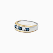 This Mens 14K Two-Tone Gold Blue and White Diamond Ring, 0.98 TCW, features five gemstones—two white diamonds at the center and three blue stones—set in a sleek channel design.