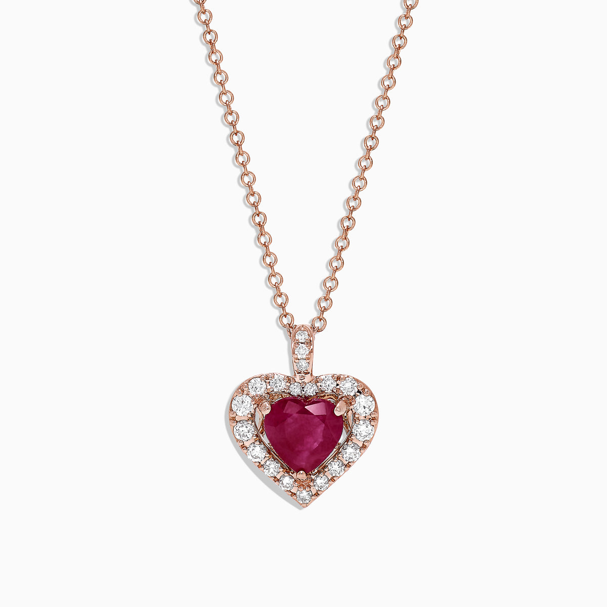 The Ruby Royale 14K Rose Gold Heart Shaped Ruby Pendant (1.28 TCW) features a romantic ruby centerpiece, accented by sparkling diamonds on a delicate rose gold chain for an elegant touch.