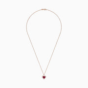 The Ruby Royale 14K Rose Gold Heart Shaped Ruby Pendant (1.28 TCW) features a romantic ruby centerpiece, accented by sparkling diamonds on a delicate rose gold chain for an elegant touch.
