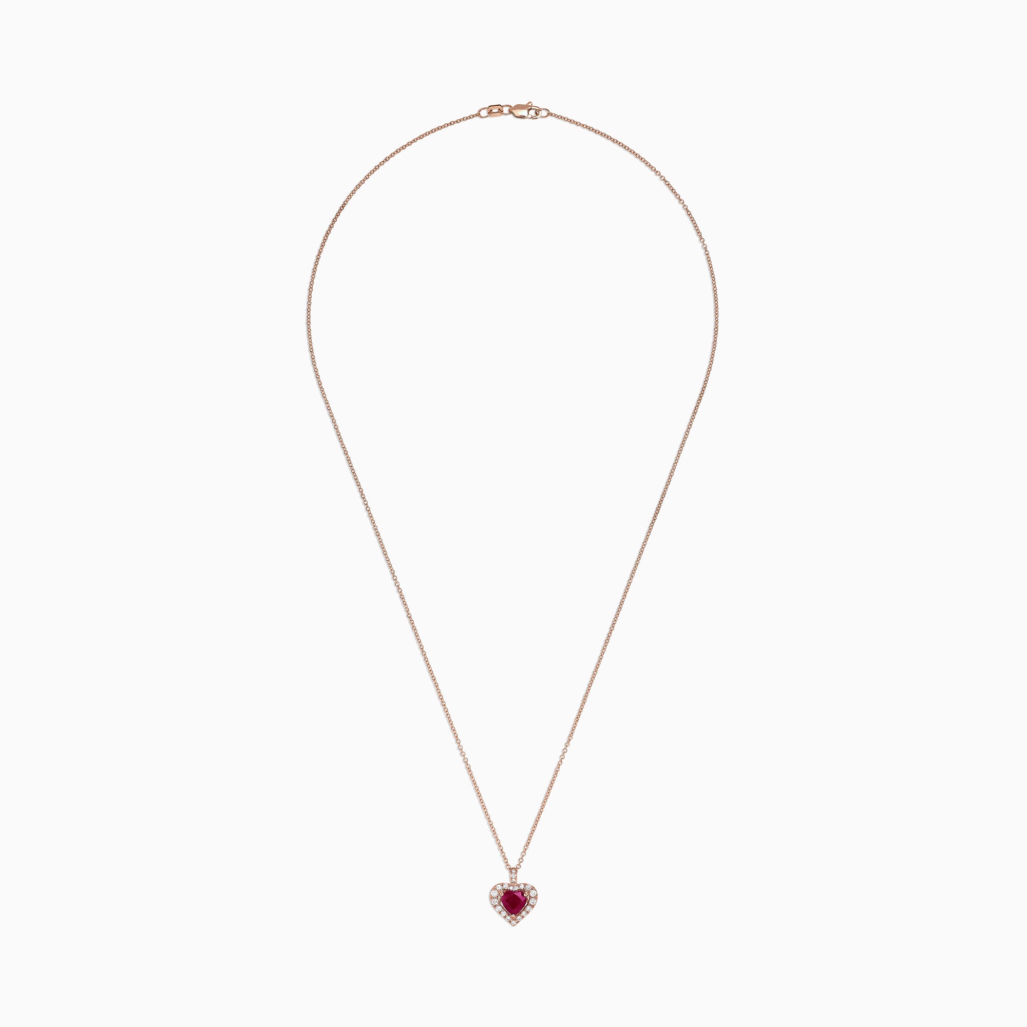 The Ruby Royale 14K Rose Gold Heart Shaped Ruby Pendant (1.28 TCW) features a romantic ruby centerpiece, accented by sparkling diamonds on a delicate rose gold chain for an elegant touch.